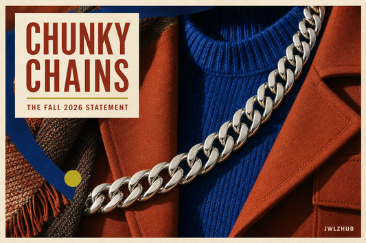 Fall street-style outfit with a chunky silver Cuban chain framed by rust fabric and cobalt graphic shapes with a JWLZHUB logo.