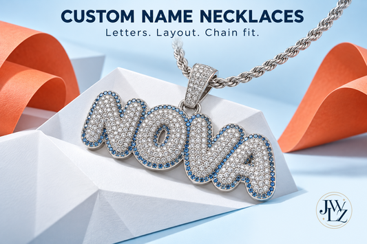 Conceptual silver-tone NOVA bubble name pendant with blue stone border and twist chain on a pale blue and coral editorial background.