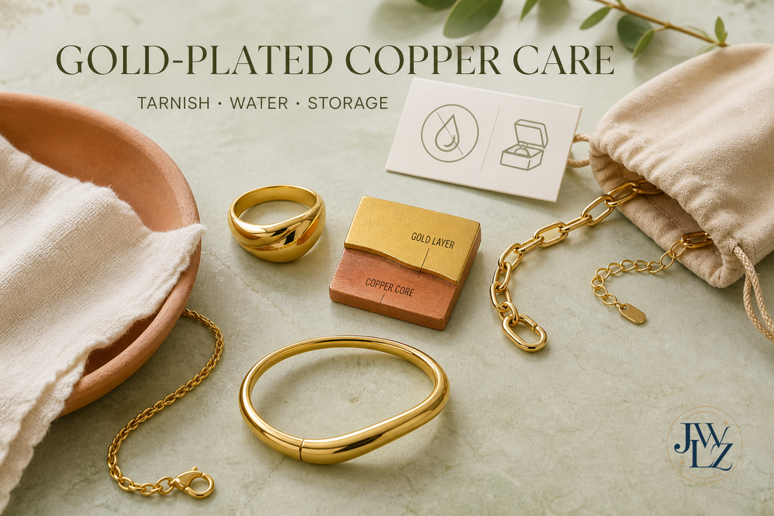 Refined gold-plated copper jewelry beside a soft cloth, dry storage pouch and illustrated metal-layer sample on a bright care table.