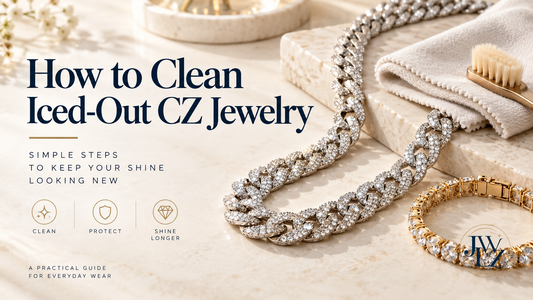 Iced-out CZ chain and bracelet beside a soft cloth and brush on a bright jewelry-care work surface.