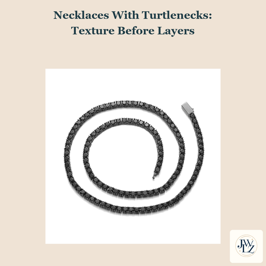 Existing black tennis chain flat-lay on a warm neutral cover titled Necklaces With Turtlenecks Texture Before Layers