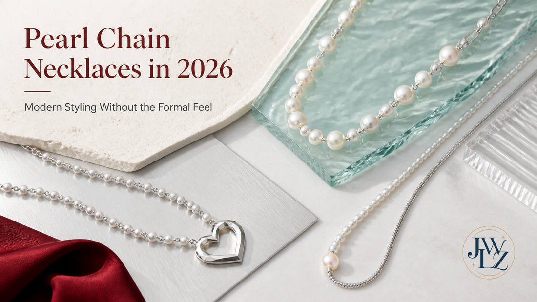 Pearl chain necklaces styled with metal links, pendants and modern wardrobe shapes on a bright editorial jewelry set.