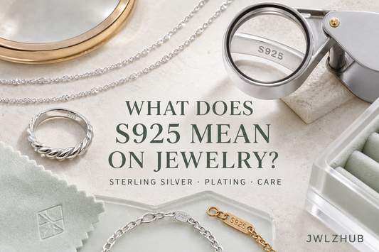 Premium sterling silver jewelry beside an enlarged S925 hallmark, plating layers and a soft polishing cloth on a bright JWLZHUB jewelry worktable.