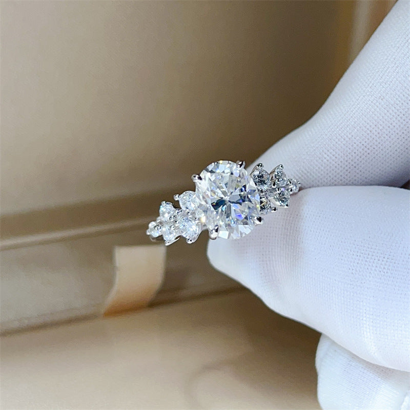 Oval Moissanite Ring for Women with Three-Stone Side Design, Four-Prong Engagement Ring, Sizes 9-20 product image