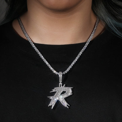 Silver-tone drip letter R necklace worn