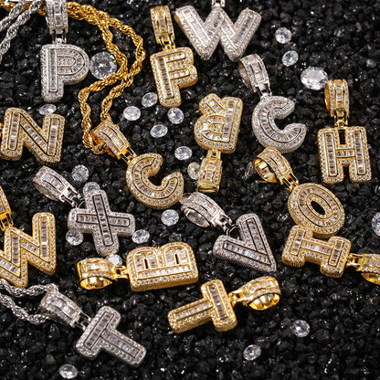 Gold and silver initial cubic zirconia pendant charms on black stone