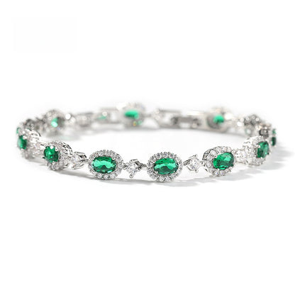 Emerald Green Oval Cubic Zirconia Tennis Bracelet in Gold, Silver & Rose Gold Tone