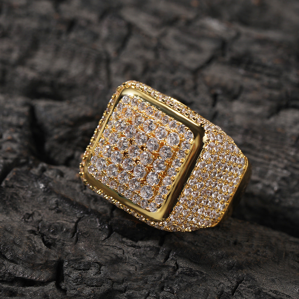Gold tone square center cubic zirconia statement ring on dark stone product image