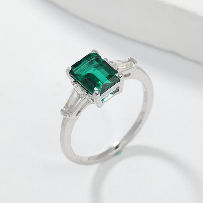 Emerald Green Three-Stone Ring with Baguette Accents