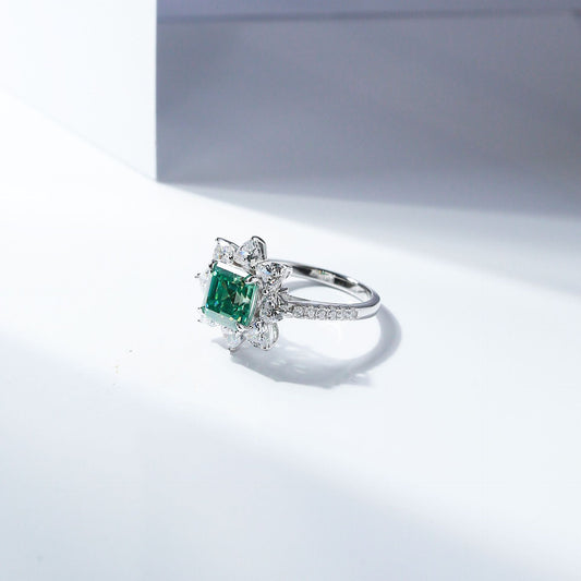 Side view of green Asscher moissanite ring with starburst halo and stone-set band alternate product image