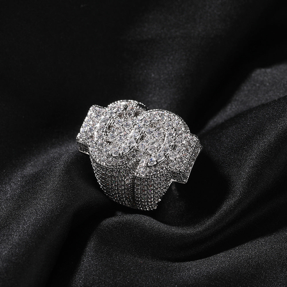 Silver tone coin-style cubic zirconia ring on black fabric product image
