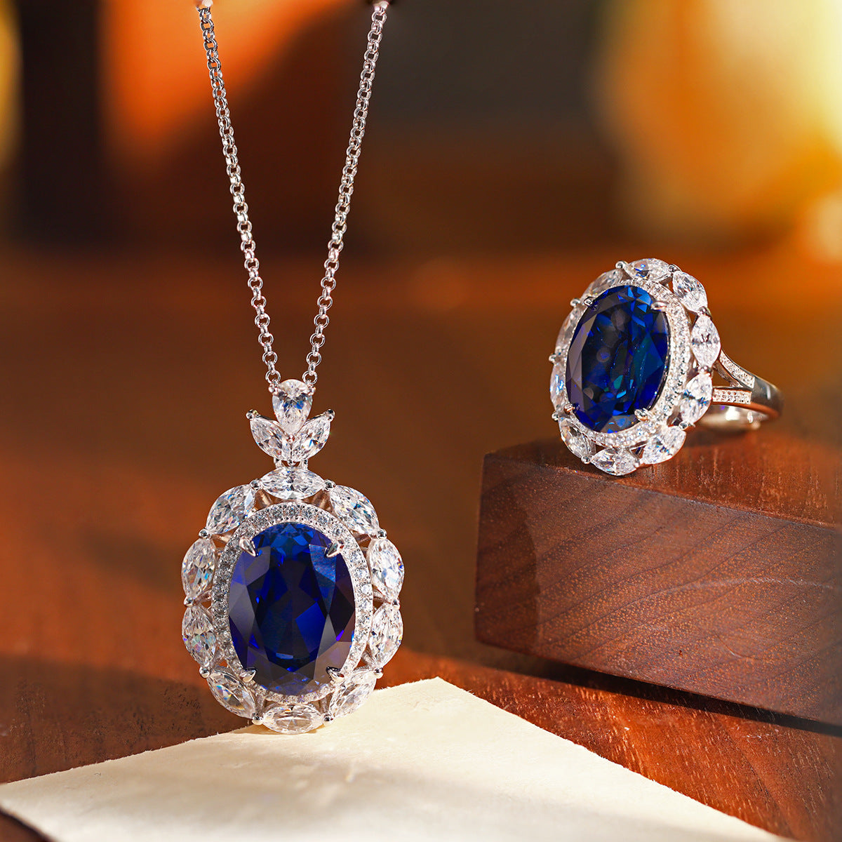 Blue Oval Floral Halo Pendant Necklace with Leaf Cluster Detail product image