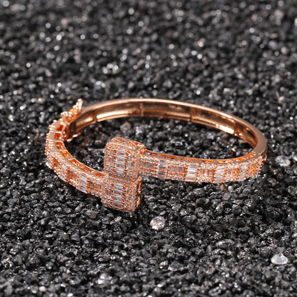 Rose gold tone ring-top cubic zirconia cuff bracelet on dark surface