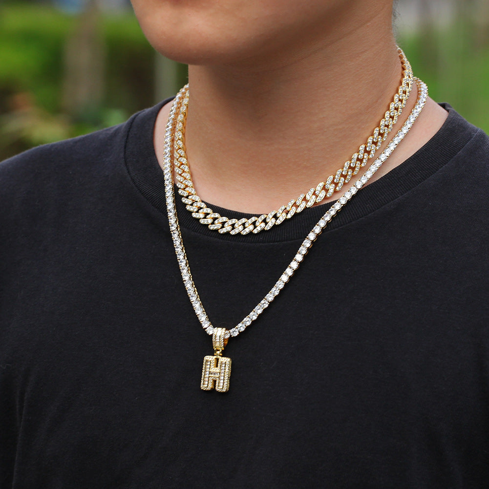 Initial cubic zirconia pendant necklace worn with layered chain product image
