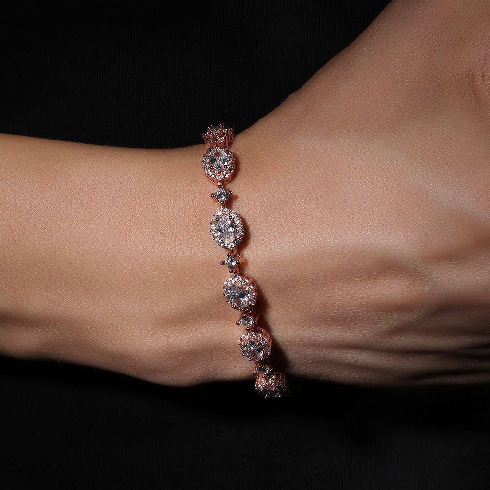 Emerald Green Oval Cubic Zirconia Tennis Bracelet in Gold, Silver & Rose Gold Tone