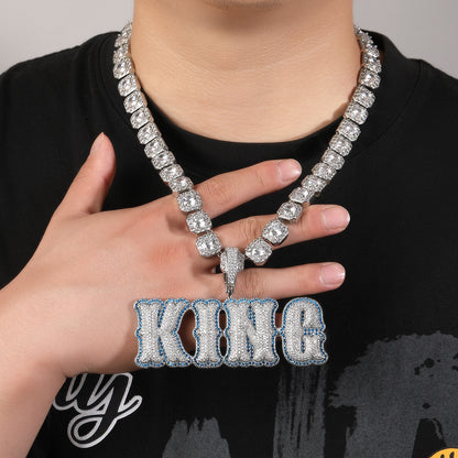 Silver-tone KING bubble pendant necklace worn by model