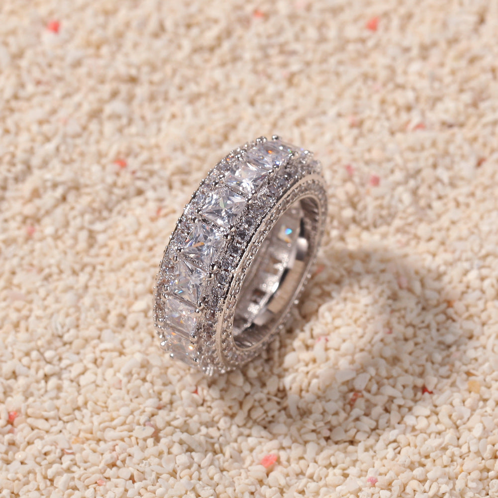 Silver tone square cubic zirconia band ring on textured surface product image