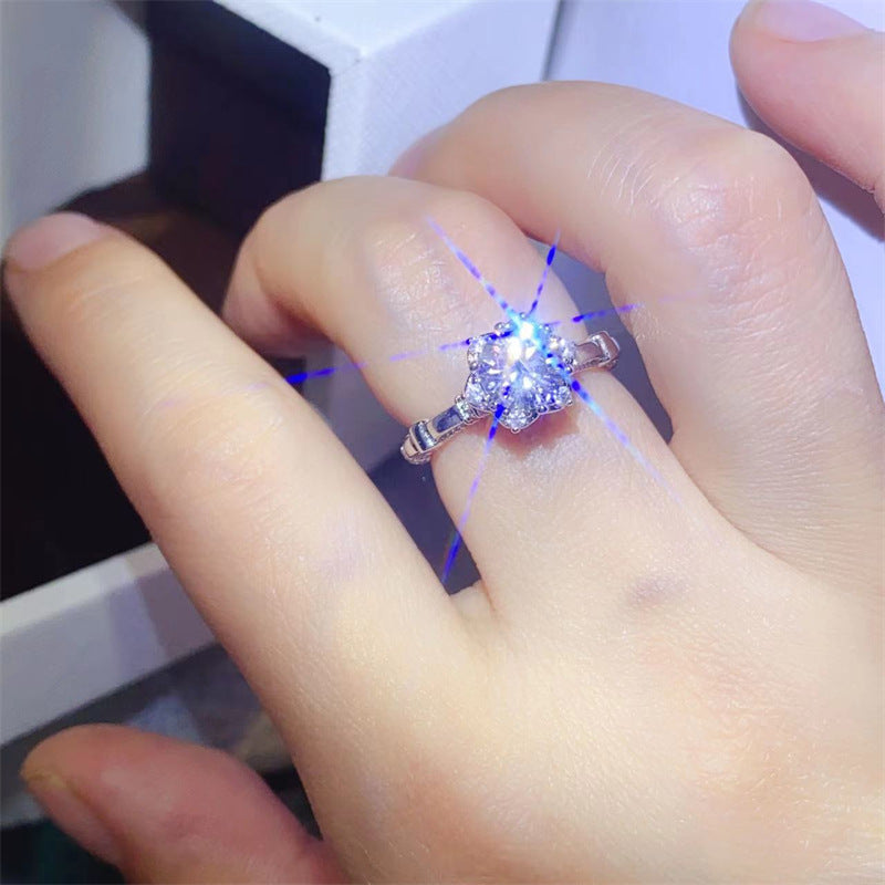 Moissanite Solitaire Ring with Pavé Band and Heart Basket Accent product image