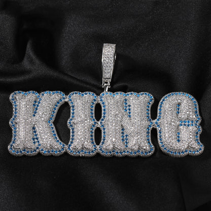 Silver-tone KING bubble pendant with blue edge