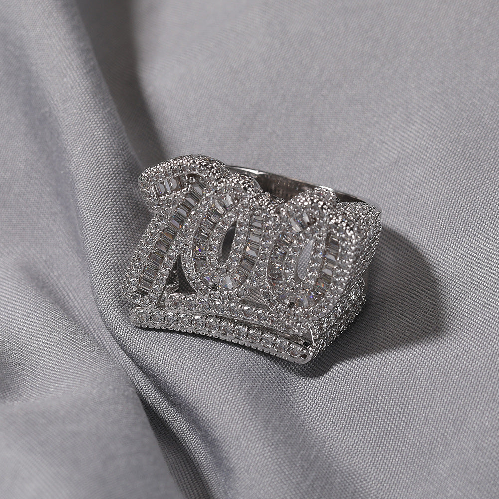 Silver tone number 100 CZ statement ring on gray fabric product image