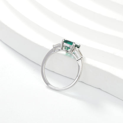 Emerald Green Three-Stone Ring with Baguette Accents