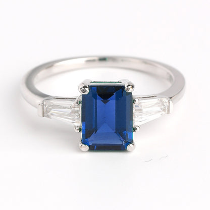 Emerald Green Three-Stone Ring with Baguette Accents
