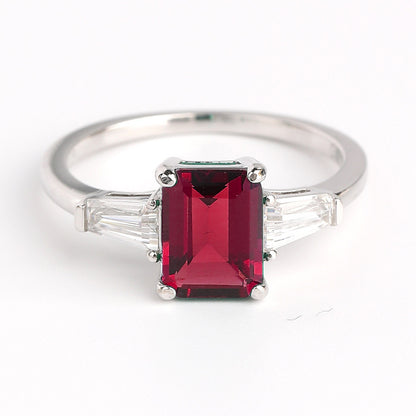 Emerald Green Three-Stone Ring with Baguette Accents